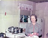 Genevieve Escher in her mother's Monticello kitchen, undated.